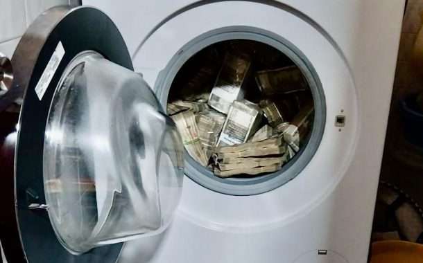 वॉशिंग मशीनमध्ये सापडली नोटांची बंडले
